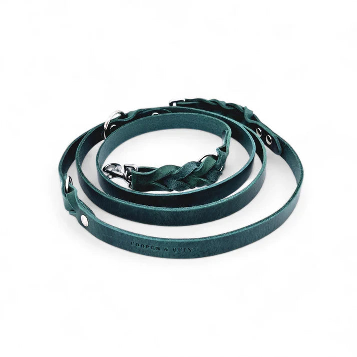 Close-up of hand-braided ends on a forest green Italian leather dog leash.