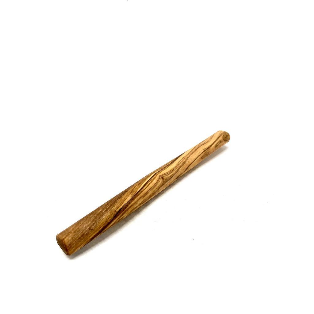 Close-up of dense, non-splintering olive wood grain for safe pet chewing.