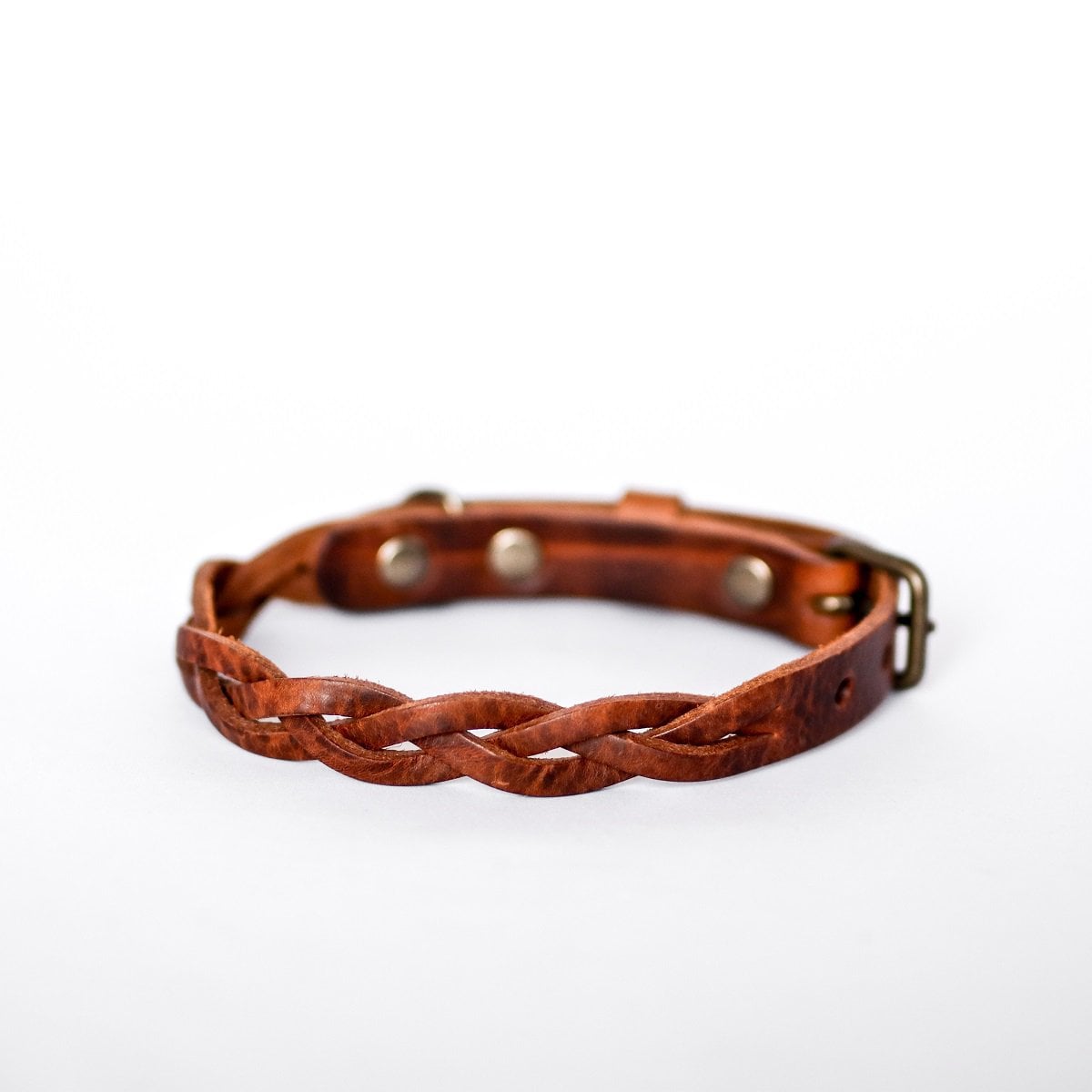 Hand-braided heritage brown leather dog collar with rust-resistant brass buckle detail.