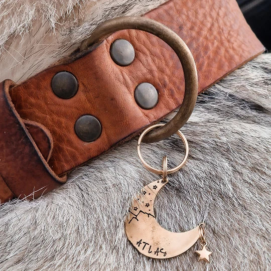 Detail of handcrafted stitching on a wide vegetable-tanned Italian leather collar.