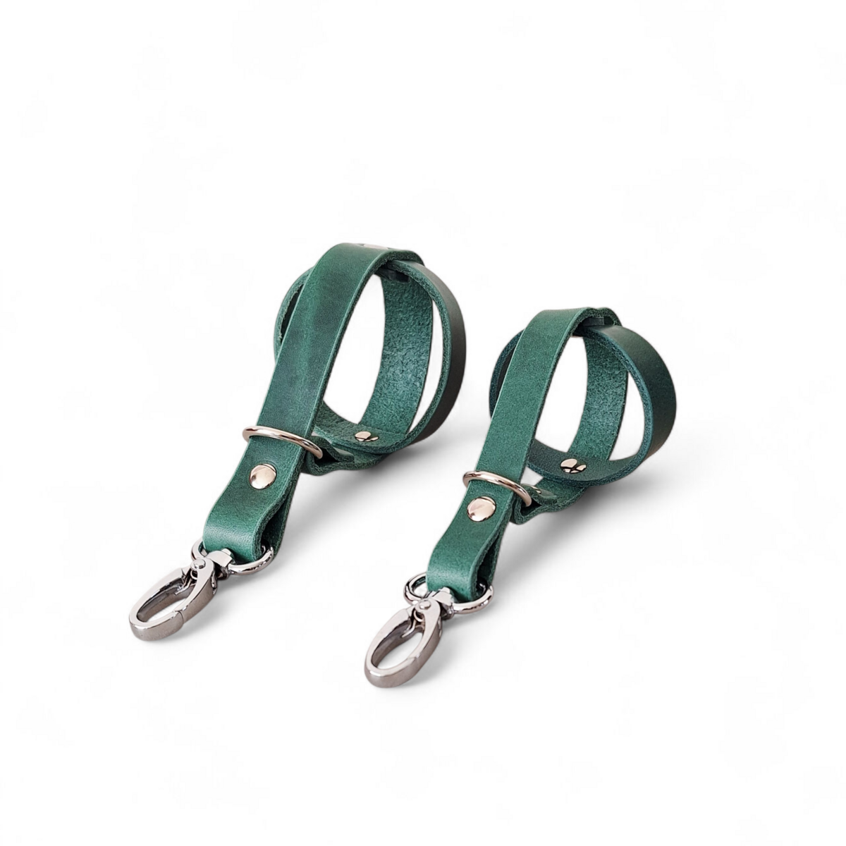 Comparison of small and standard leather dog ball holders in forest green.