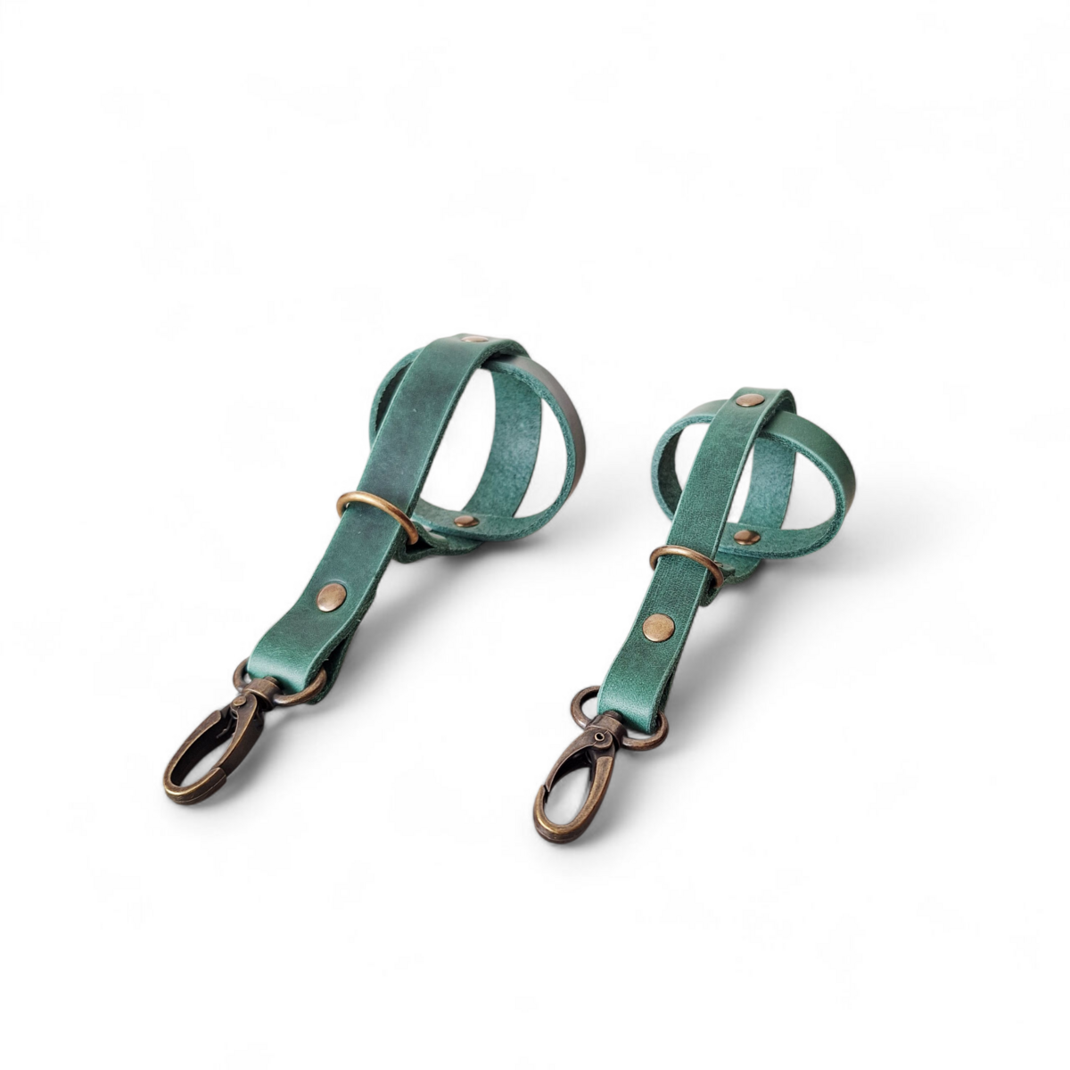 Comparison of small and standard leather dog ball holders in forest green.