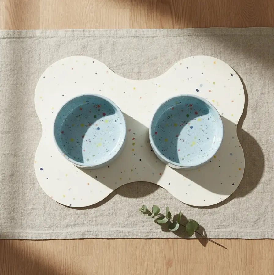 Soft Blue Splatter 16.5 cm bowls on a bone-shaped placemat
