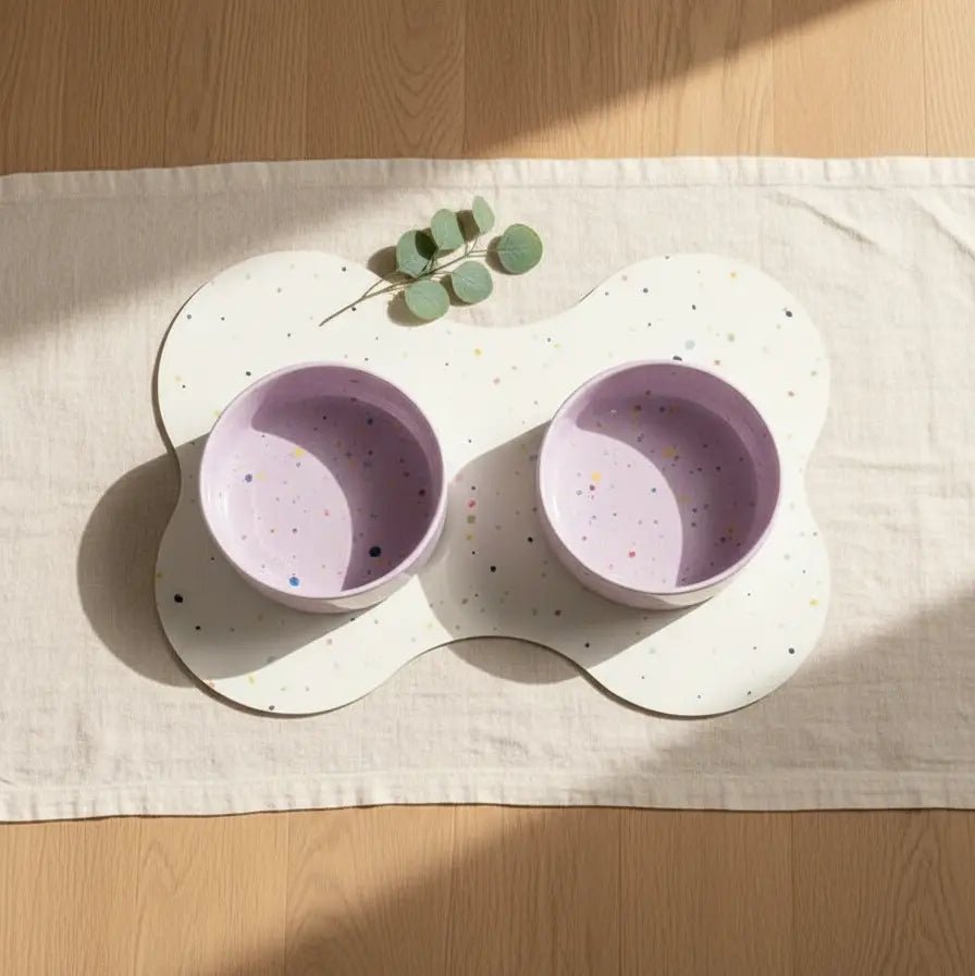 Dreamy Lilac Splatter 16.5 cm bowls on a bone-shaped placemat