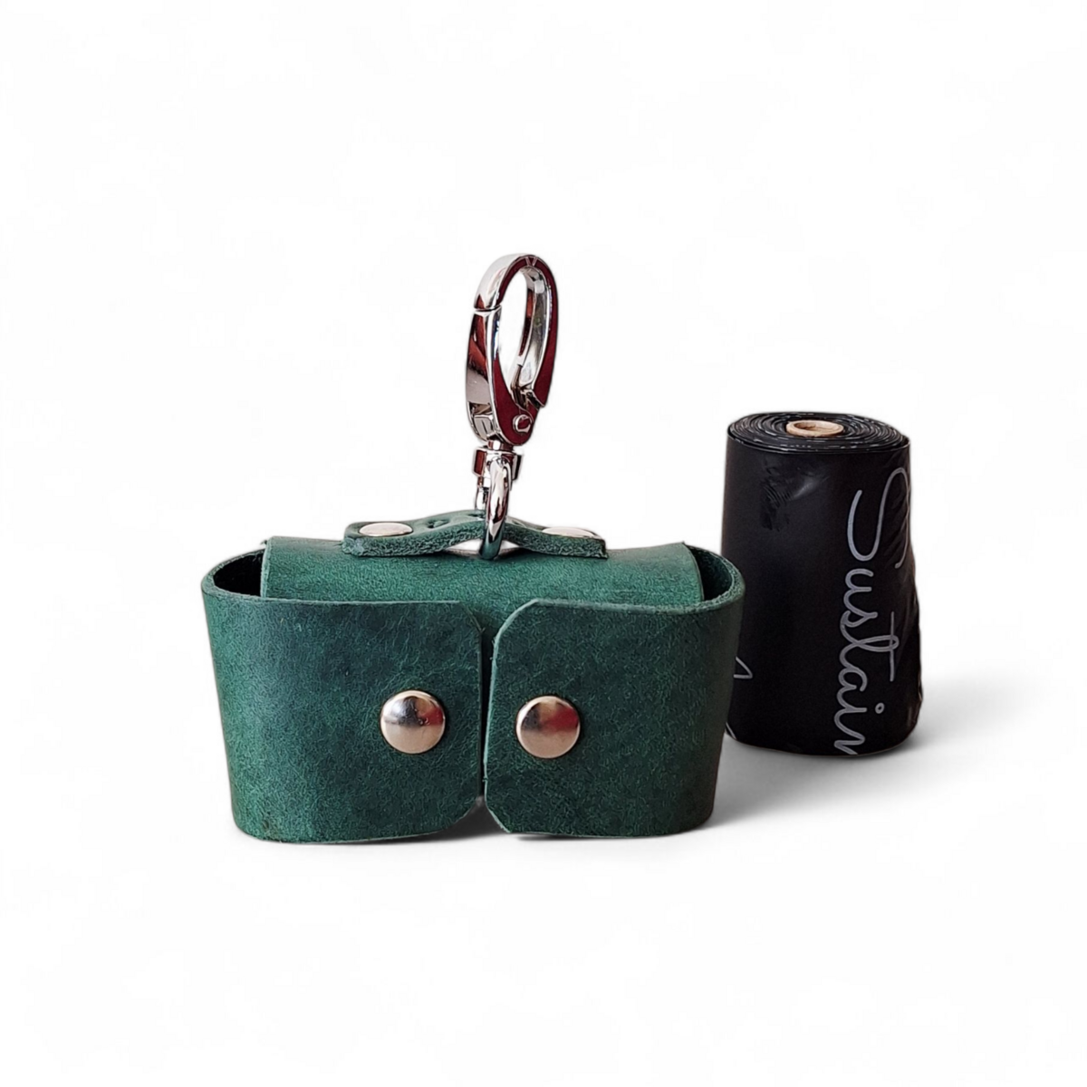 Smart-dispense opening on a handcrafted green leather dog bag pouch.