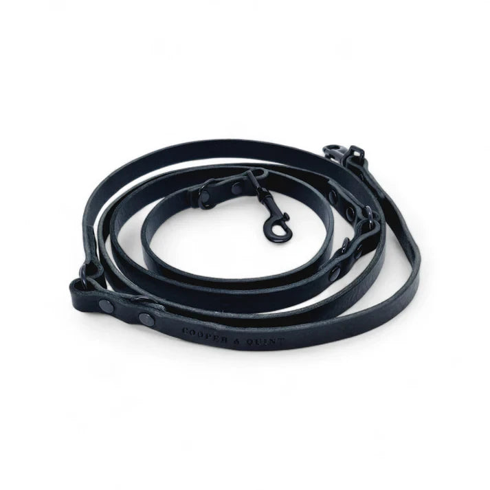 Detail of matte black hardware on a black Italian leather multi-functional leash.