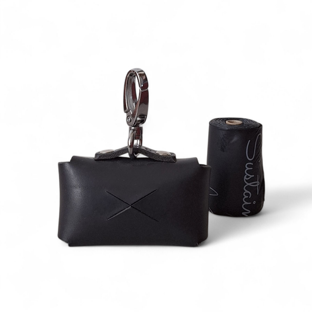 Interior of leather dog bag dispenser showing sustainable poop bag roll.