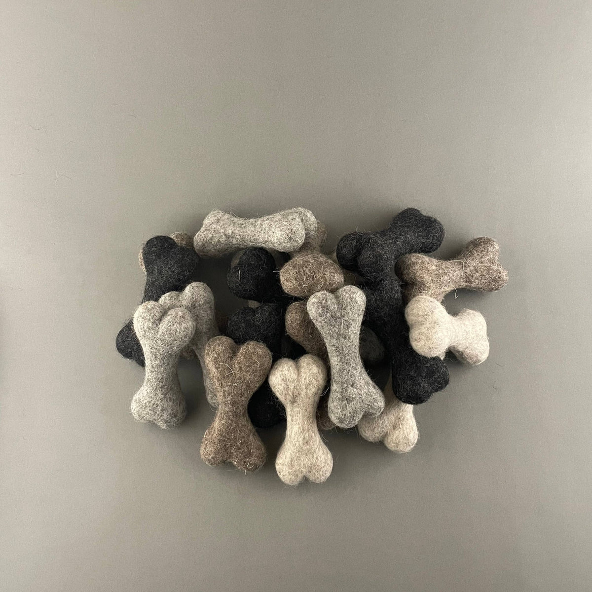 Handful of petite 10 cm felted wool dog bones