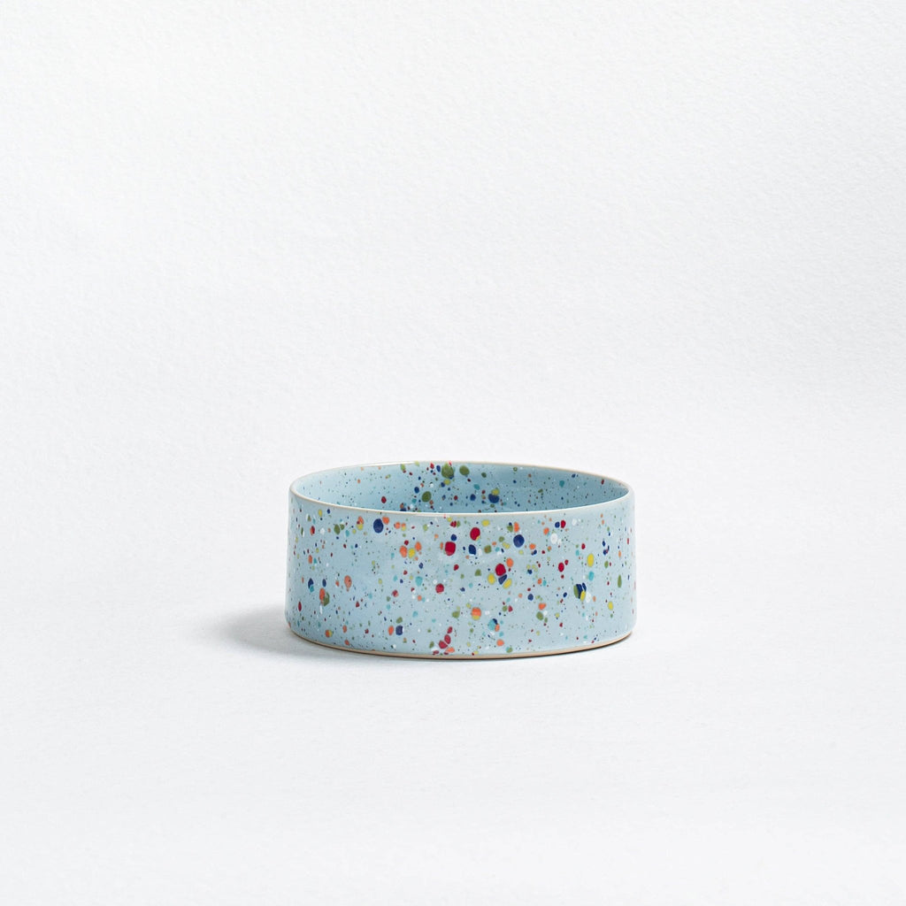 Soft Blue Splatter stoneware dog bowl on a white background